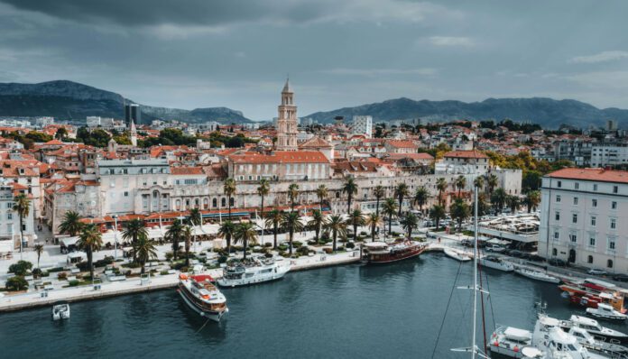 Split Old Town aerial view — Diocletian's Palace and Adriatic Aerial view of Split Old Town showing Diocletian's Palace walls and the Adriatic Sea, Croatia. Perfect Split Itinerary